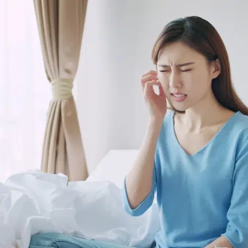 A woman with dry and uncomfortable skin